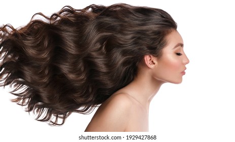 Beautiful Brown-haired Girl With A Perfectly Curls Hair, And Classic Make-up. Beauty Face And Hair. Picture Taken In The Studio.