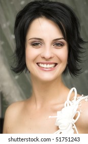 Beautiful brunette bride with short styled hair
