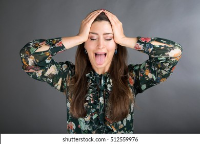 Beautiful Brunette Doing Face Yoga Exercise