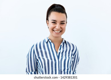 Beautiful brunette girl portrait against white background. Laughter and joy emotions - Shutterstock ID 1429381301