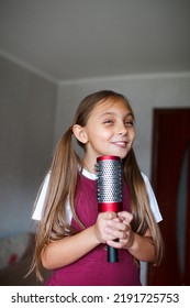 Beautiful Brunette Little Girl Singing In Brush At Home. Kid Enjoying Singing Hairbrush Mic. Recording Studio.