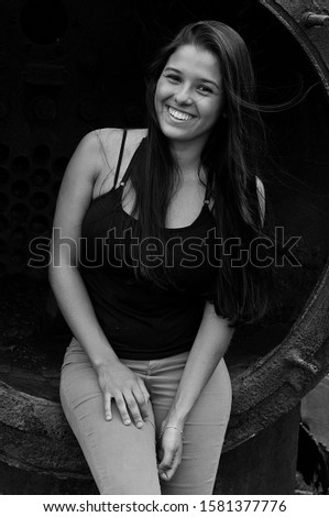 Similar – Woman at the window of a parking garage