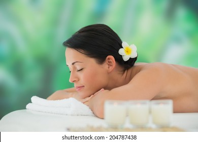 Beautiful Brunette Relaxing On Massage Table At A Luxury Spa
