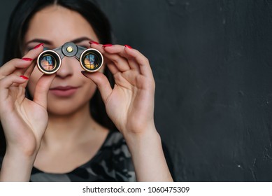 Beautiful Brunette Sexy Spy Agent (killer Or Police) Woman With A Binocular In Her Hand Stalking Someone