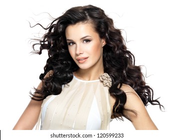 Beautiful Brunette Woman With Beauty Long Curly Hair. Fashion Model With Wavy Hairstyle