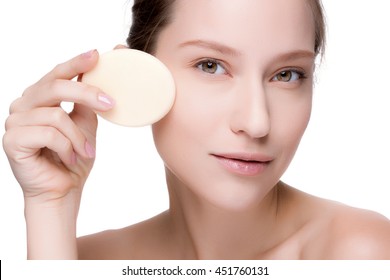 Beautiful brunette woman with clean perfect fresh skin using cotton pad skin care concept. Isolated on a white.