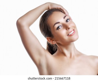 Beautiful Brunette Woman Holding Her Arms Up And Showing Underarms, Isolated On White Studio Background