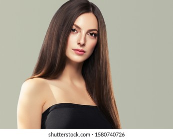 Beautiful brunette woman with long hair natural makeup face closeup - Shutterstock ID 1580740726