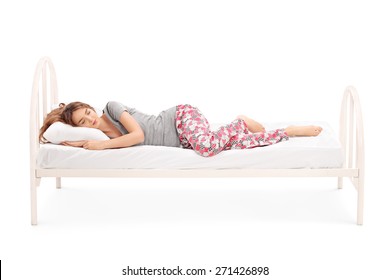 Beautiful Brunette Woman In Pajamas Sleeping In A Comfortable Bed Isolated On White Background