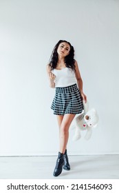 Beautiful Brunette Woman With Polar Bear Toy