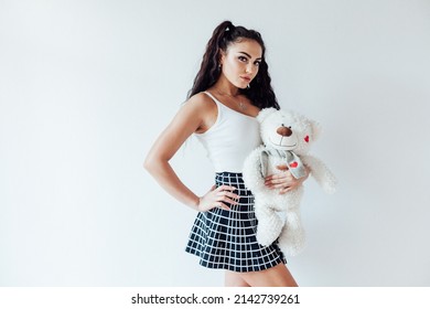 Beautiful Brunette Woman With Polar Bear Toy