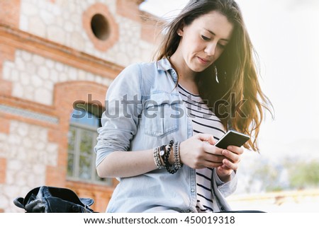 beautiful woman talking on the phone while laughing.