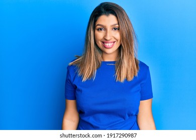 Beautiful Brunette Woman Wearing Casual Blue Tshirt With A Happy And Cool Smile On Face. Lucky Person. 