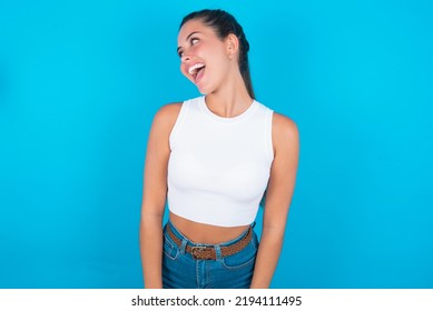 Beautiful Brunette Woman Wearing Withe Tank Top Shirt Over Blue Background Very Happy And Excited About New Plans.