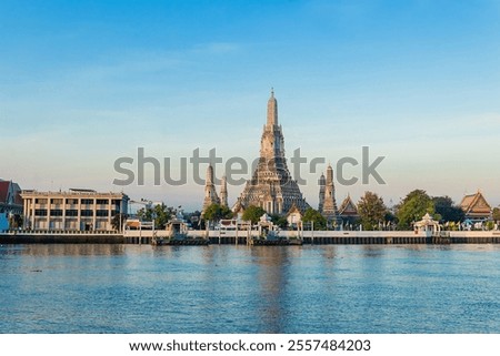 Beautiful of Buddhist temple or Wat Arun Ratchawararam Ratchawaramahawihan with famous tourist landmark sunlight in the morning, Bangkok, Thailand.