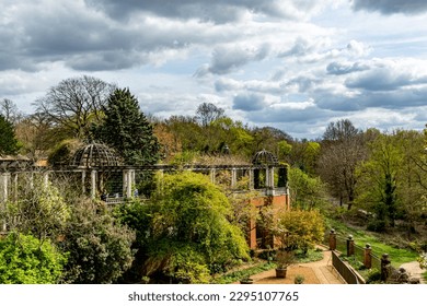 Beautiful building in the forest with cloudy sky - Shutterstock ID 2295107765