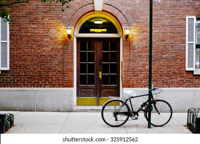 Beautiful building in Soho district. Entrance door and bicycle, Manhattan New York USA. Classic apartment building in New York City. Beautiful american street.