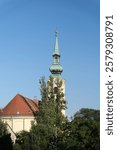 Beautiful building with a spire in Budapest. Church with a spire in Budapest. Hungarian architecture.