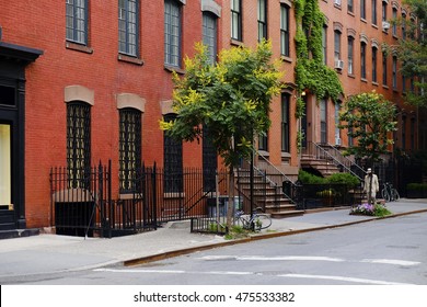 Beautiful Buildings In Greenwich Village, Soho District. Entrance Doors With Stairs And Trees, Manhattan New York. Classic Red Brick Apartment Building In New York City. Beautiful American Street.