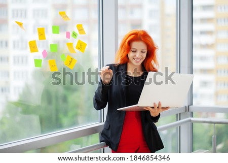 Beautiful business lady working with laptop in office