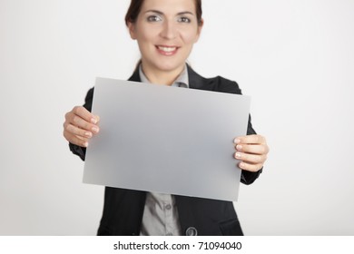 Beautiful Business Woman Holding A Blank Translucent Paper Sheet