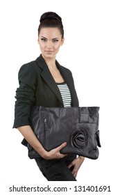 Beautiful business woman holding a purse, isolated on white