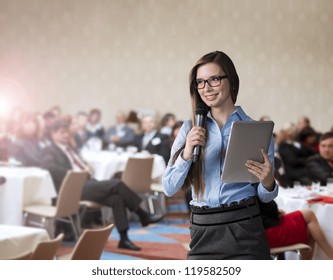 Beautiful business woman is speaking on conference. - Powered by Shutterstock