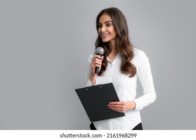 Beautiful Business Woman Is Speaking On Conference. Microphone Speech Speaking Concept. Young Beautiful Woman Singing Song Using Microphone.