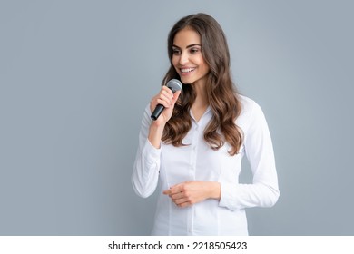 Beautiful Business Woman Is Speaking On Conference. Microphone Speech Speaking Concept. Young Beautiful Woman Singing Song Using Microphone.