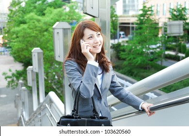 Beautiful Business Woman Walking Outside Her Office. Portrait Of Asian.