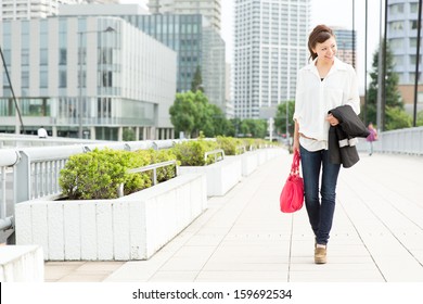 Beautiful Business Woman Walking Outside Her Office. Portrait Of Asian. 