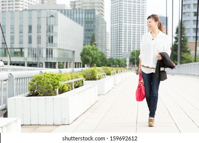 Beautiful Business Woman Walking Outside Her Office. Portrait Of Asian. 