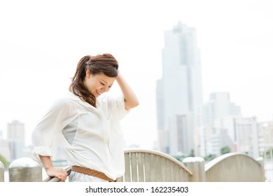 Beautiful Business Woman Walking Outside Her Office. Portrait Of Asian. 