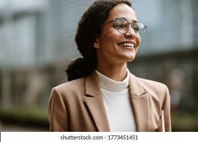 Beautiful Business Woman Walking Outside On Road. Businesswoman With Eyeglasses On City Street.