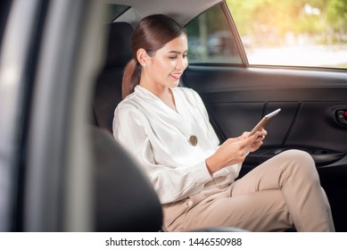 Beautiful business woman is working in car