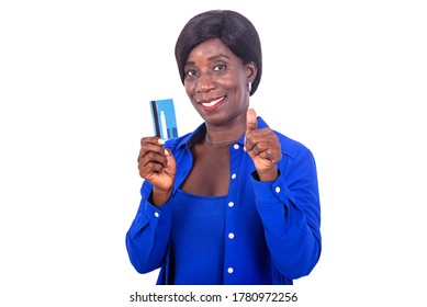 beautiful businesswoman in blue shirt standing on white background presenting credit card and making okay gesture smiling. - Powered by Shutterstock