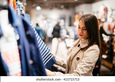 Beautiful businesswoman buying clothes