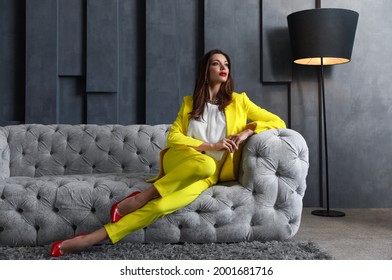 Beautiful businesswoman on sofa indoors. Luxury lifestyle