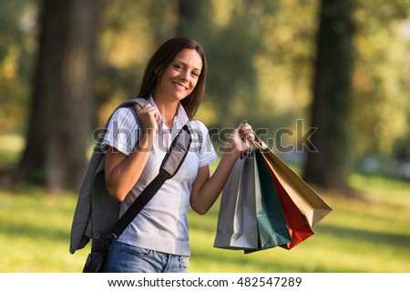 Beautiful businesswoman took a break from work to go for a shopping.Businesswoman enjoys in shopping
