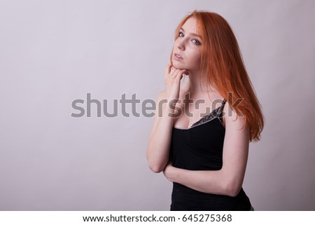 Beautiful Busty Redhead Woman In Studio Photo On Gray Background Sexuality And Sensuality Attractive Beautiful Busty Redhead Woman In Studio Photo On Gray Background Sexuality And Sensuality Attractive