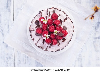 Beautiful Cake With Fresh Raspberries And Pink Cream. Sweet Festive Pastries. View From Above. Free Space For Text Or A Postcard.