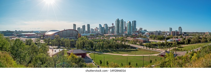 Beautiful Calgary City Skyline From Scotsman’s Hill On A Sunny Day, Canada. Shining Sun. Panarama 2019