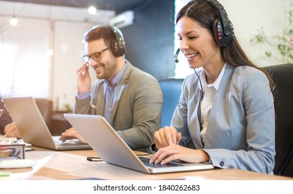Beautiful call center smiling operator agent with phone headset working in office. - Shutterstock ID 1840262683