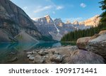 A beautiful calm summer morning at the glacial blue waters of Moraine Lake in Banff National Park, Alberta, Canada. 