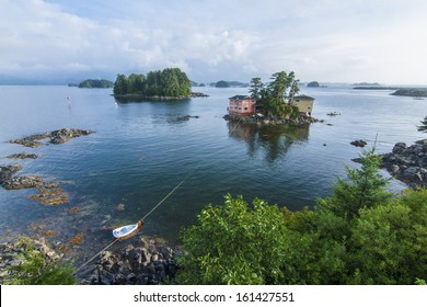 Beautiful Calm Summer, Seascape With Boat And Houses On Tiny Forested Islands In Sitka Sound On Baranof Island, Alaska