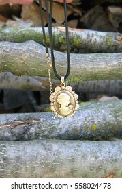 Beautiful Cameo Necklace , On The Real Woods Background