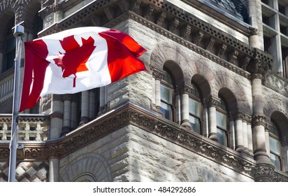 Beautiful Canada Flag Is Waving Front Of A Historical Building