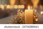 Beautiful candle scene with warm bokeh and white flowers for peaceful ambiance. An elegant candle scene with delicate white flowers and a soft, calming background.