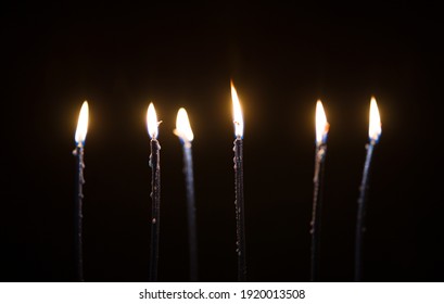 beautiful candles burning in the dark