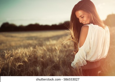 Beautiful Carefree Woman In Wheat Meadow
